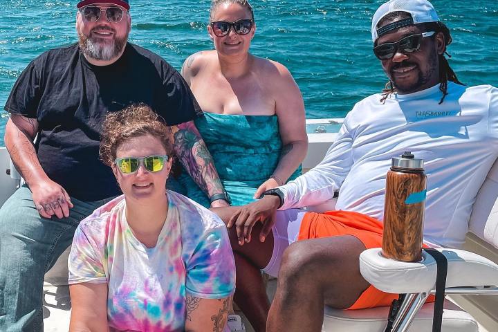 a group of people sitting on a boat