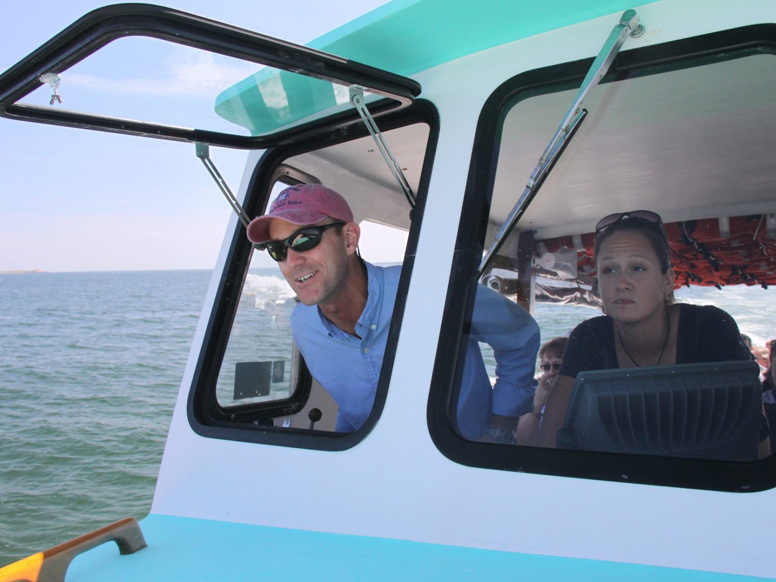 a man driving a boat in the water