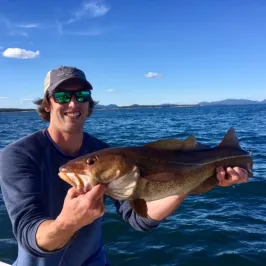 Captain Sarge holding a fish in the water