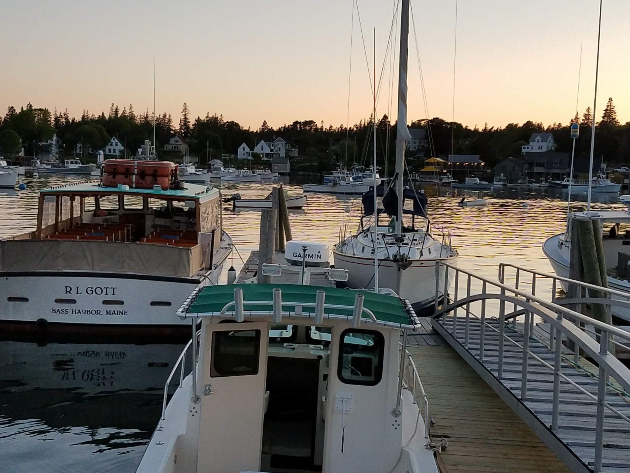 a boat is docked next to a body of water