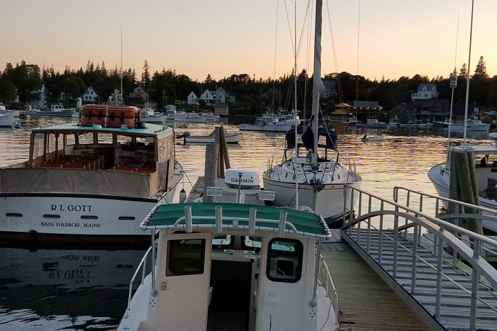 a boat is docked next to a body of water