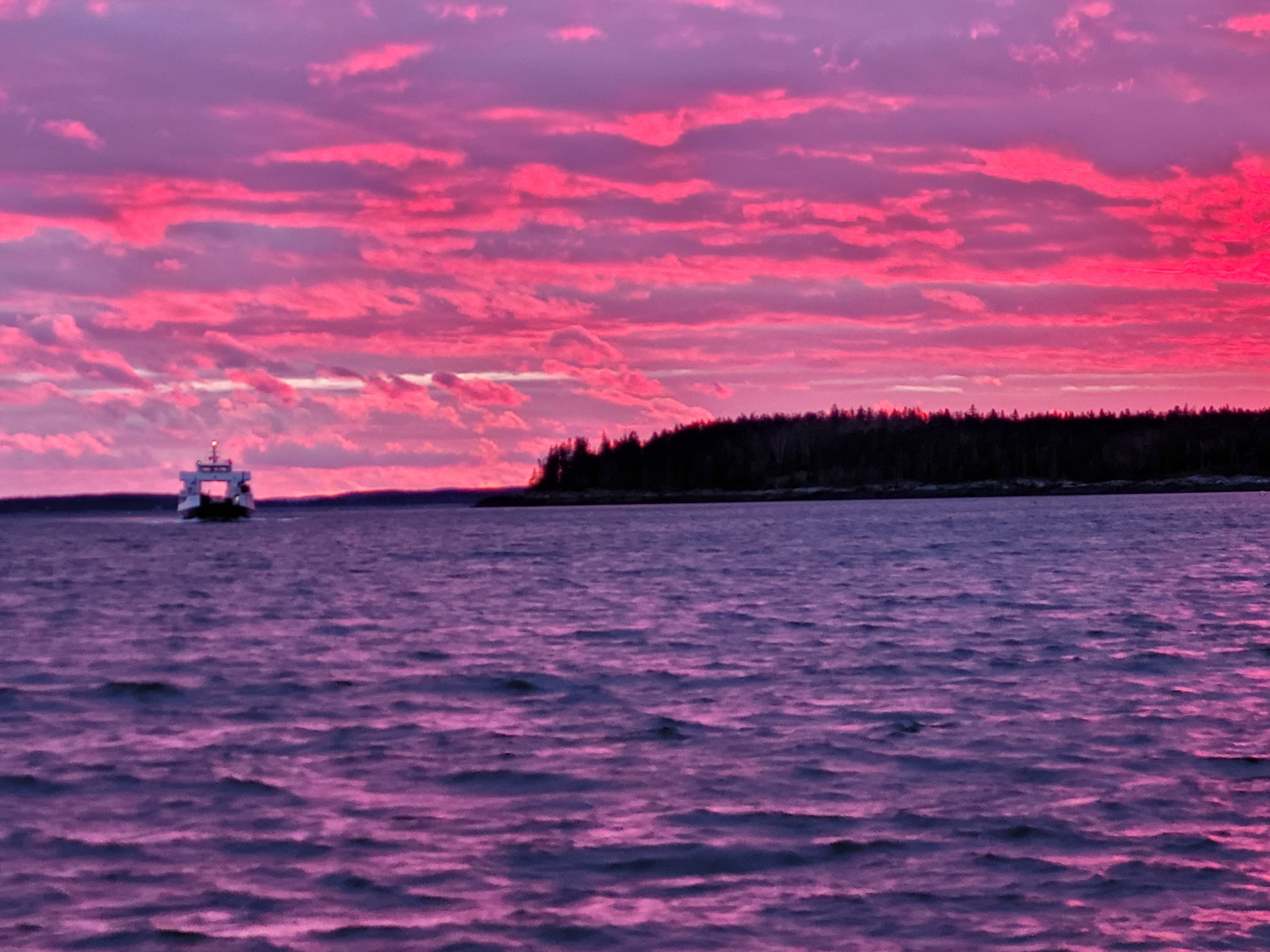 a sunset over a body of water
