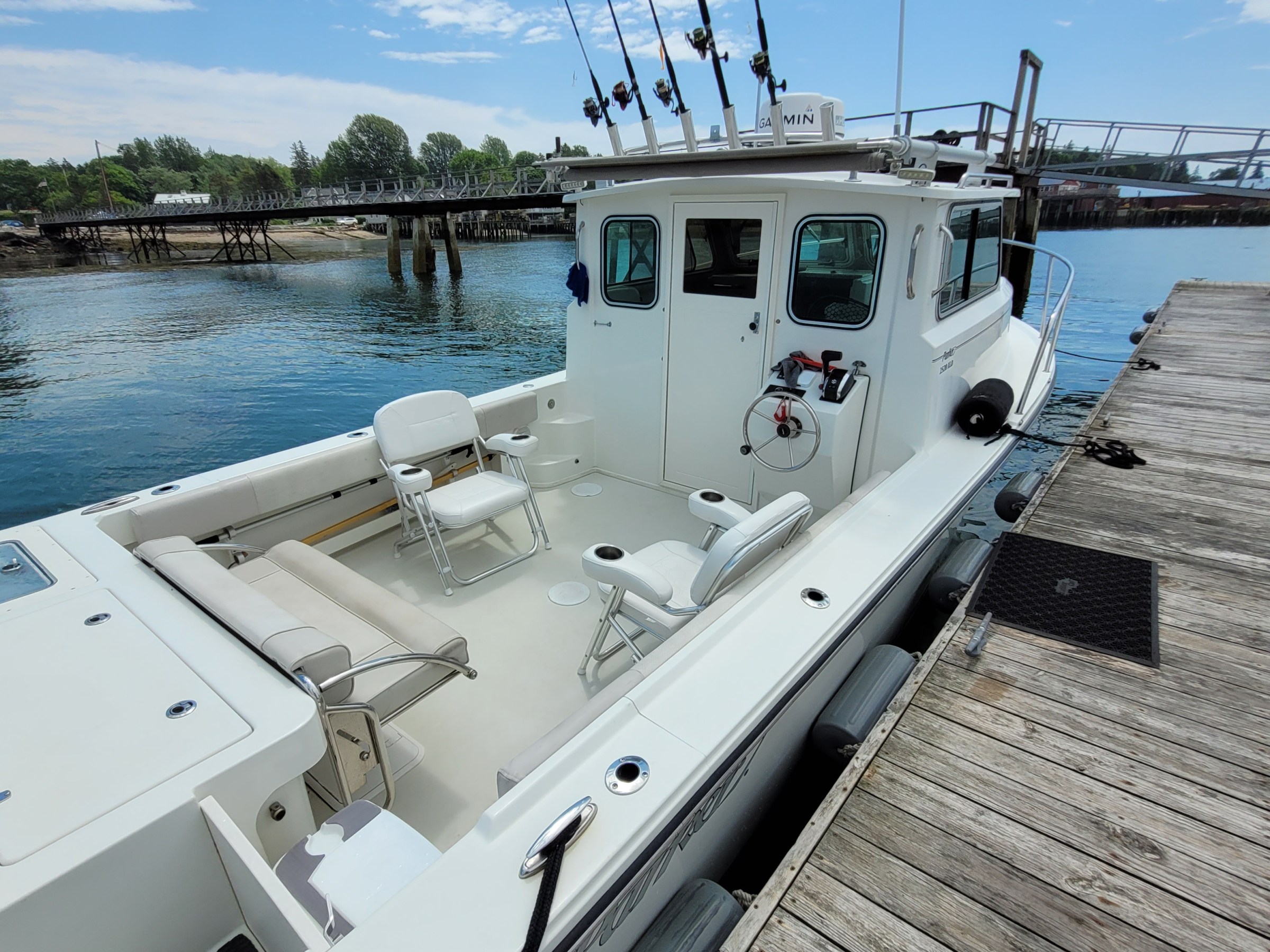 a boat is docked next to a body of water