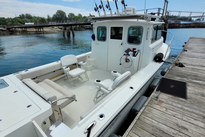 a boat is docked next to a body of water