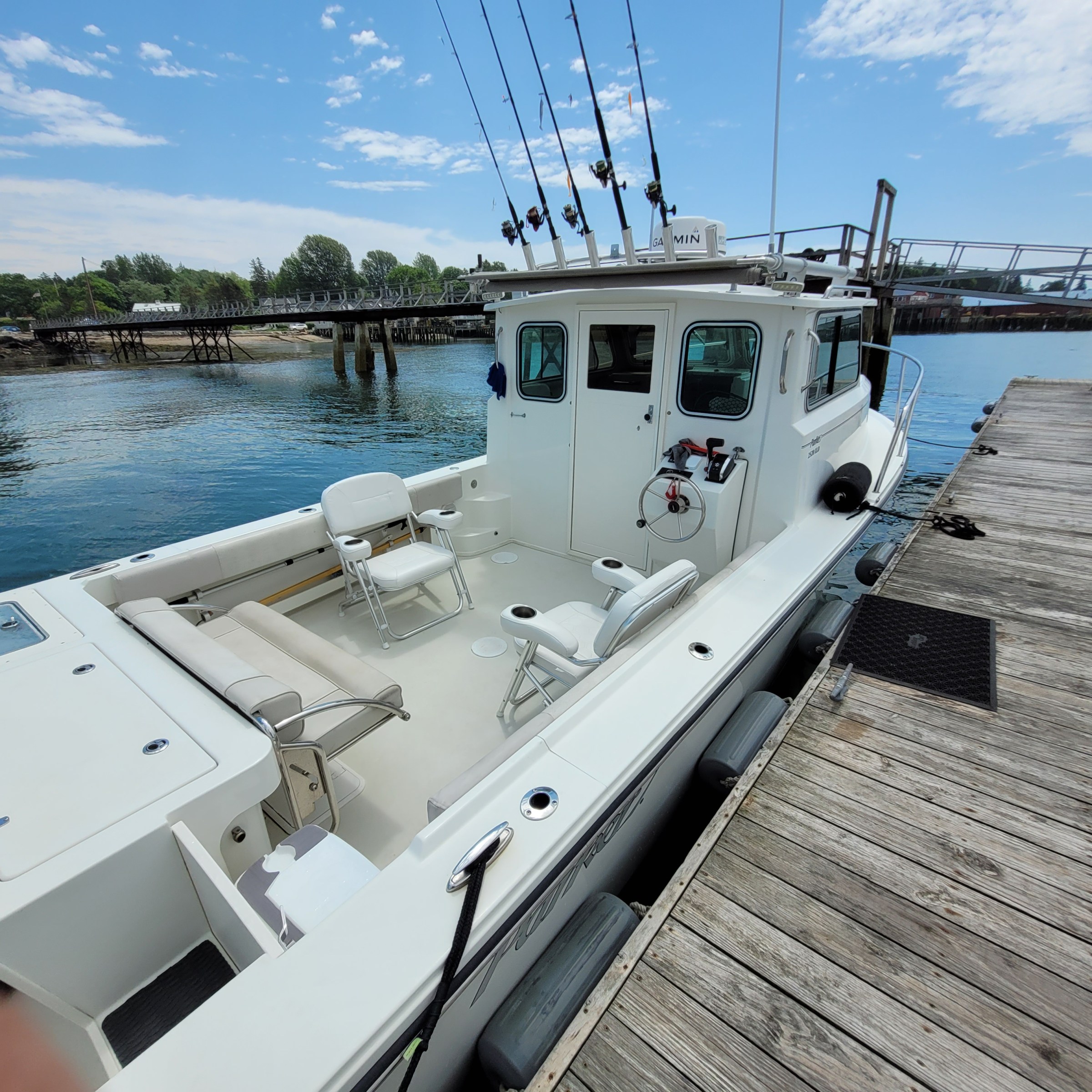 a boat is docked next to a body of water