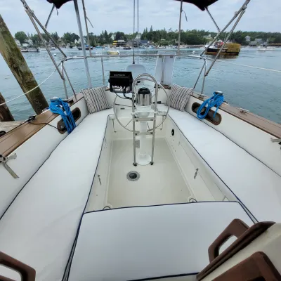 a boat is docked next to a body of water